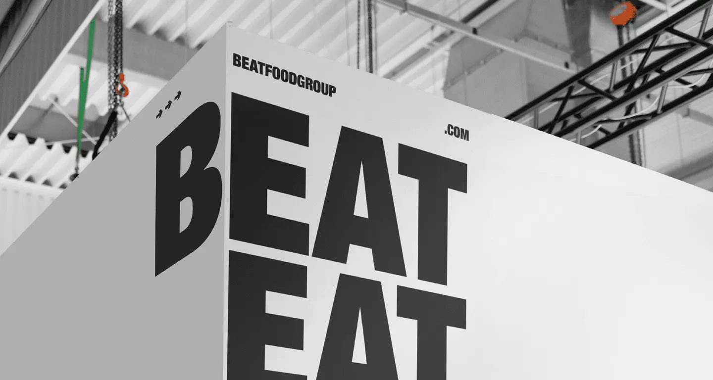 Large BEAT EAT typography applied to an architectural wall