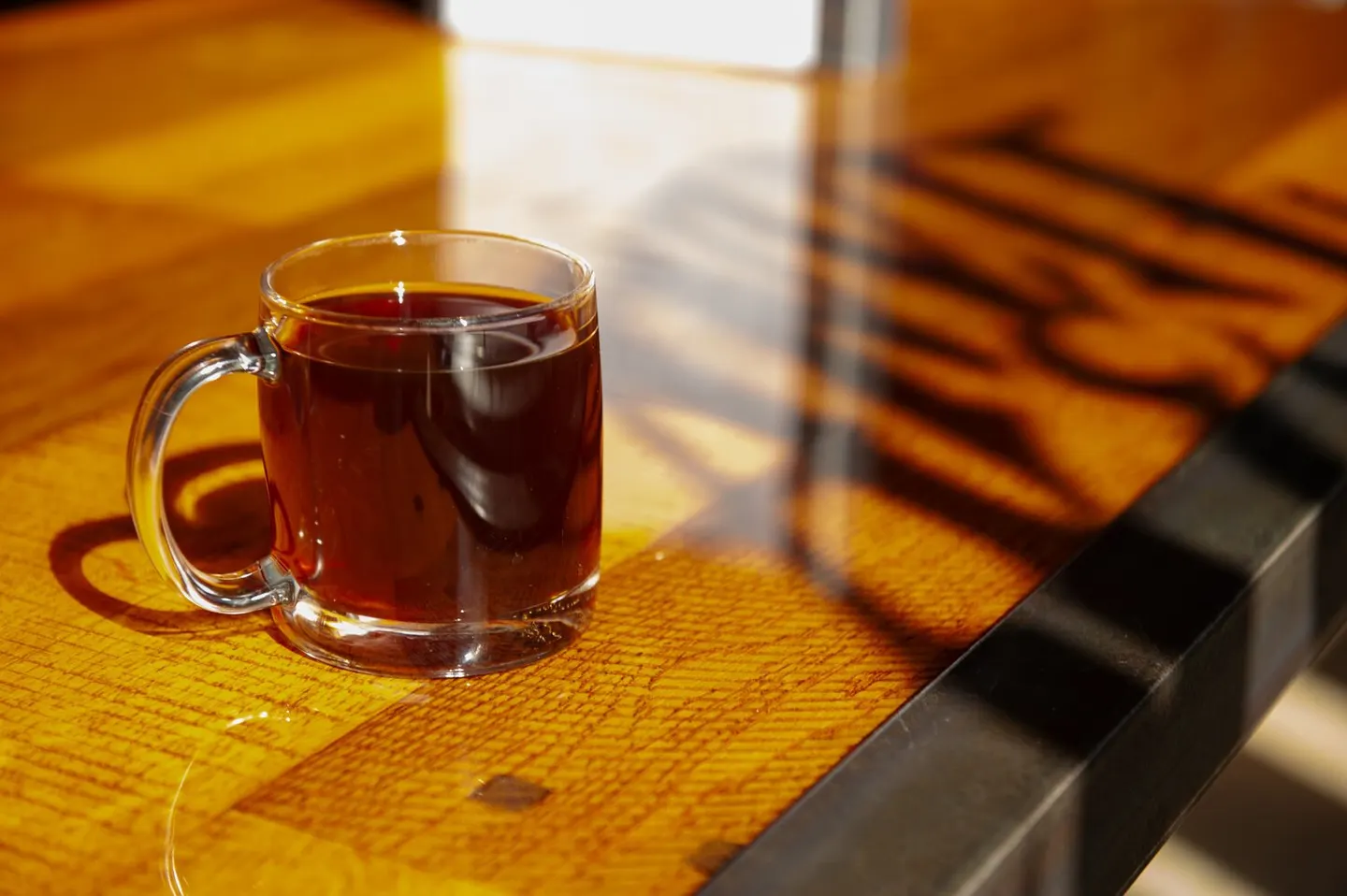 A warm drink on a wooden table in the brewery