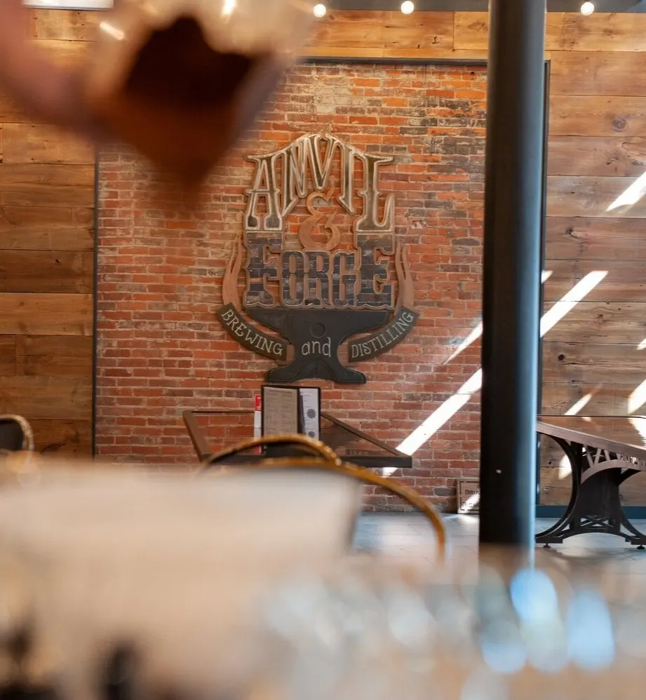 Anvil & Forge wall lettering in the brick brewery interior